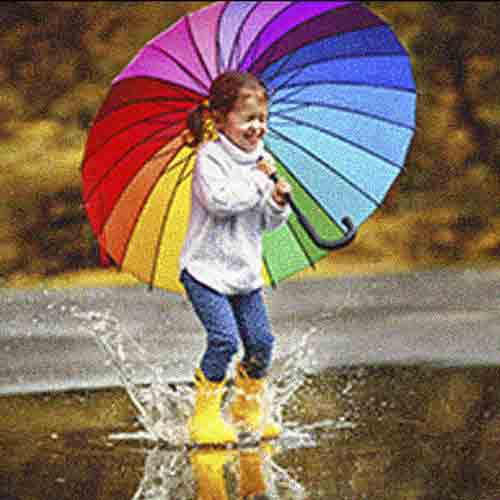Low-resolution photo of a girl with a rainbow umbrella, looking pixelated and grainy. This will not print well.