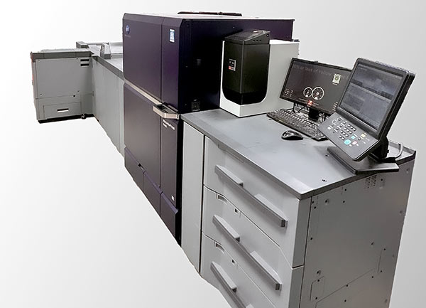 One of DocuCopies.com's new Konica Minolta AccurioPress C14010 digital color presses and finisher