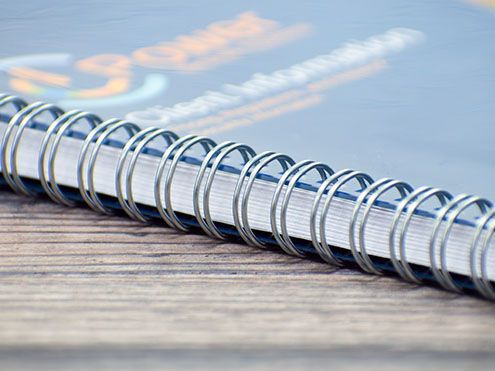 Wire-o bound books with double-loop metal wire bindings